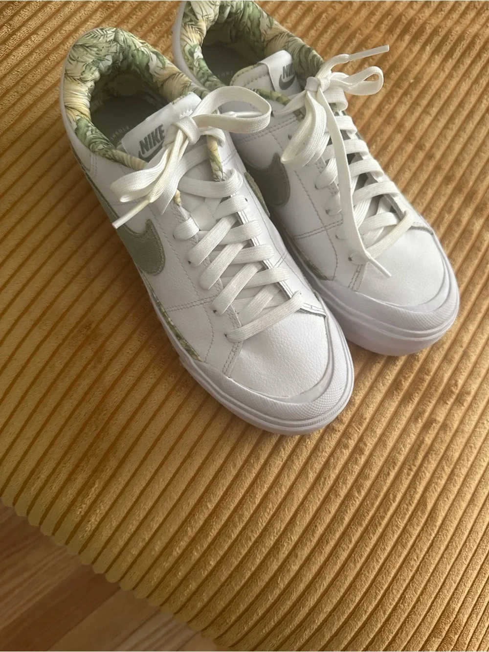 Nike Women's White Sneakers with Olive Swoosh and Leaf-Print Collar